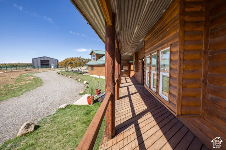 Expansive wood-finish porch with a corrugated metal ceiling