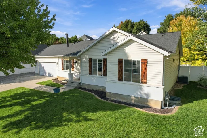 White siding exterior with dark shingle roofing