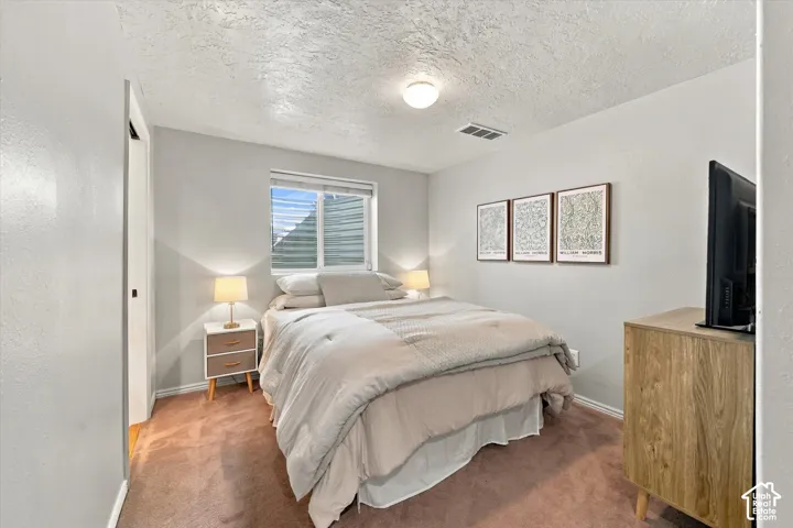 Carpeted flooring, recessed window, ceiling-mounted light fixture, and light gray wall paint