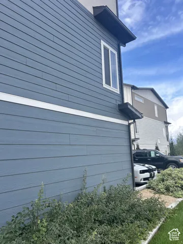 Blue horizontal siding exterior with white trim
