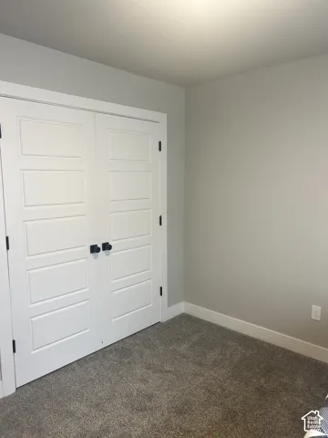 White paneled bifold doors with matte black hardware
