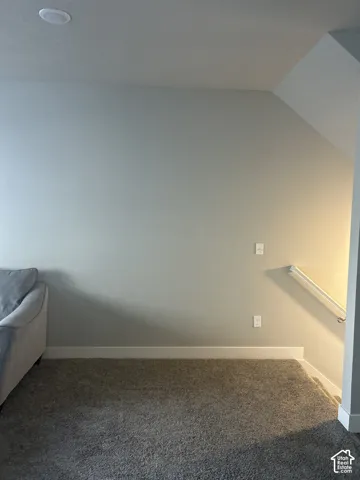 Recessed ceiling lighting, textured wall finish, and neutral wall color