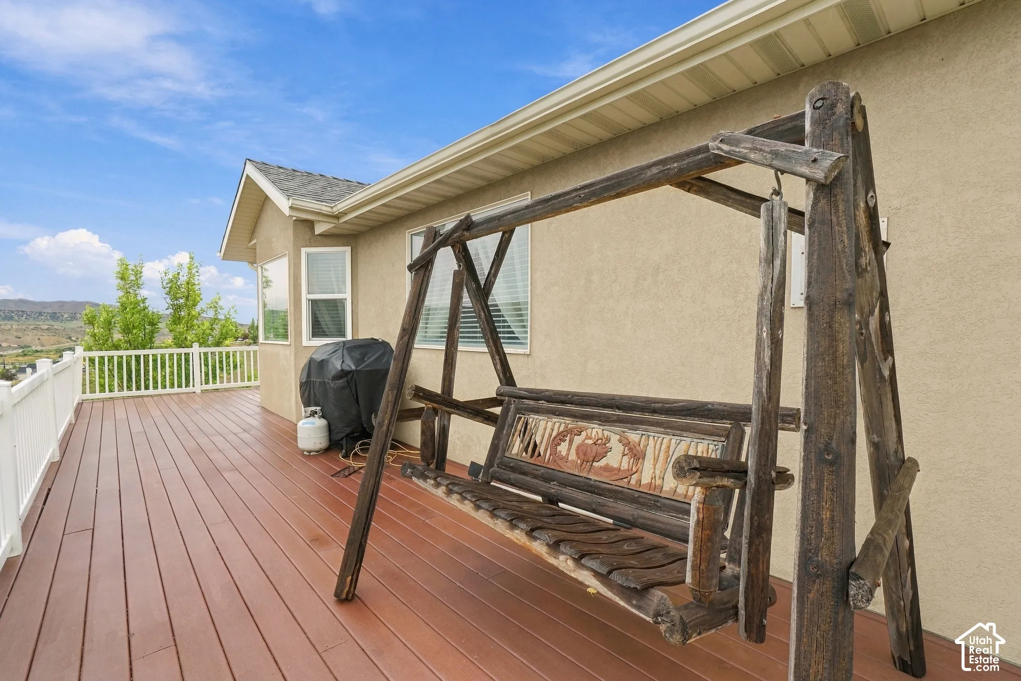 Expansive elevated deck with composite flooring and white railing