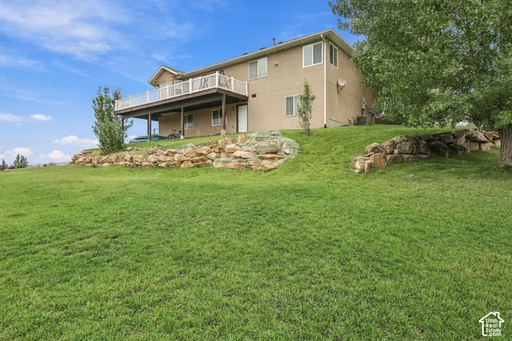 Tiered landscaping with natural rock retaining walls