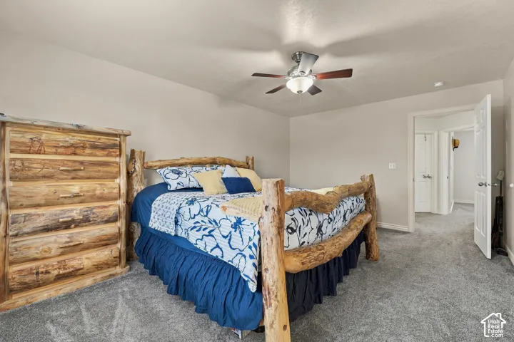 Neutral-toned walls complement the gray carpeting