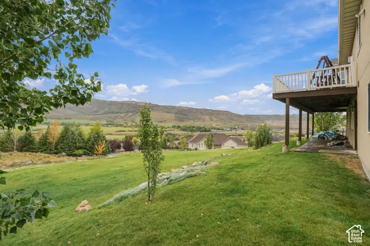 Expansive green lawn with mountain backdrop
