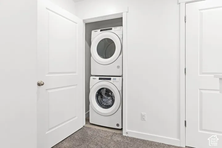 Stackable washer and dryer combination within a dedicated closet