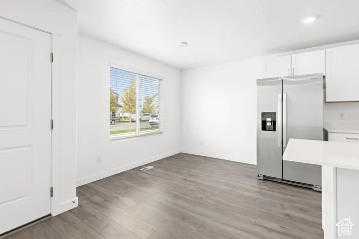 Wood-finish flooring with white walls