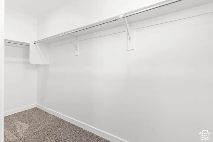 Built-in shelving and closet rods provide organization