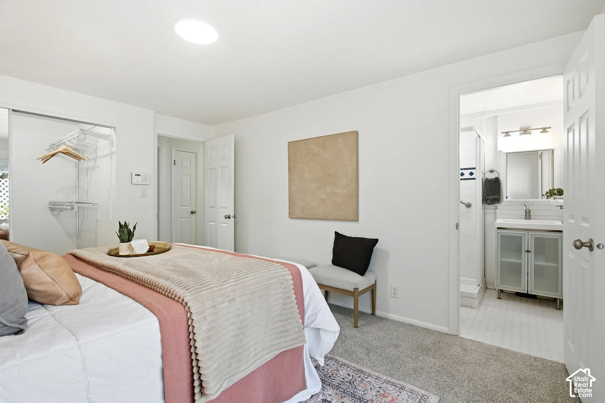 Primary Bedroom Suite with Ensuite BathroomSpacious primary bedroom featuring carpet flooring, recessed ceiling lighting, and direct access to a private ensuite bathroom