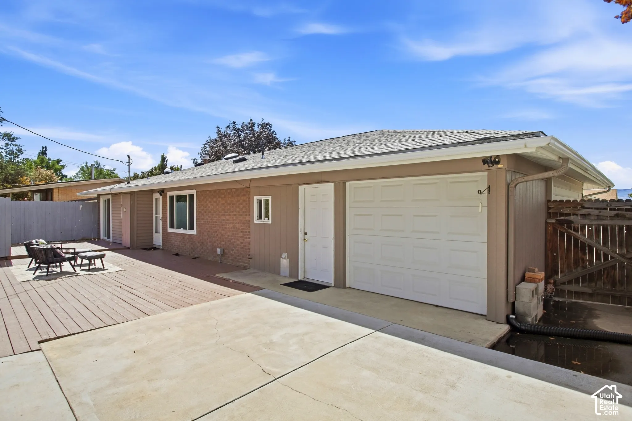 Back of home with Attached two-car garage, and garage door at rear of attached garage