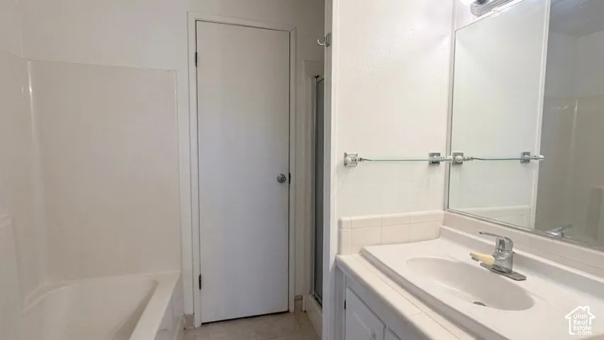 Bathroom vanity with an integrated sink and chrome faucet