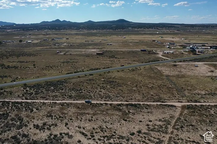 Expansive undeveloped land with a distant mountain backdrop