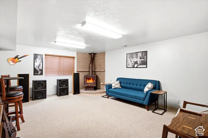 Recessed brick wood-burning stove with a metal flue