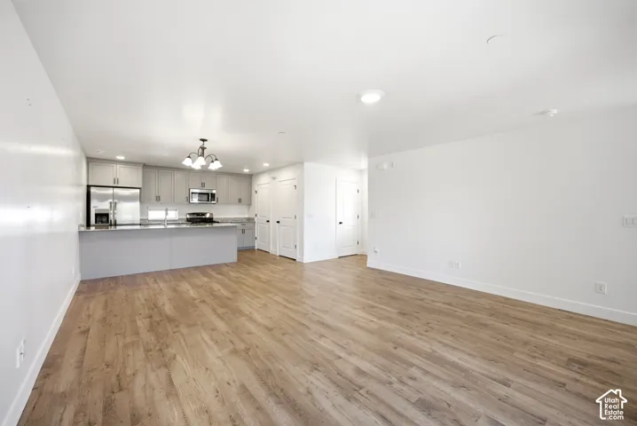 Open-concept living space featuring wood-finish flooring