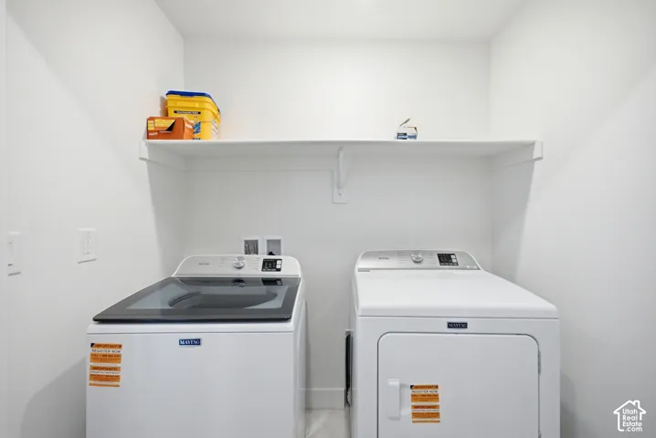 White walls and a built-in shelf provide storage