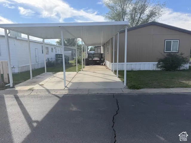 Covered carport with concrete paving