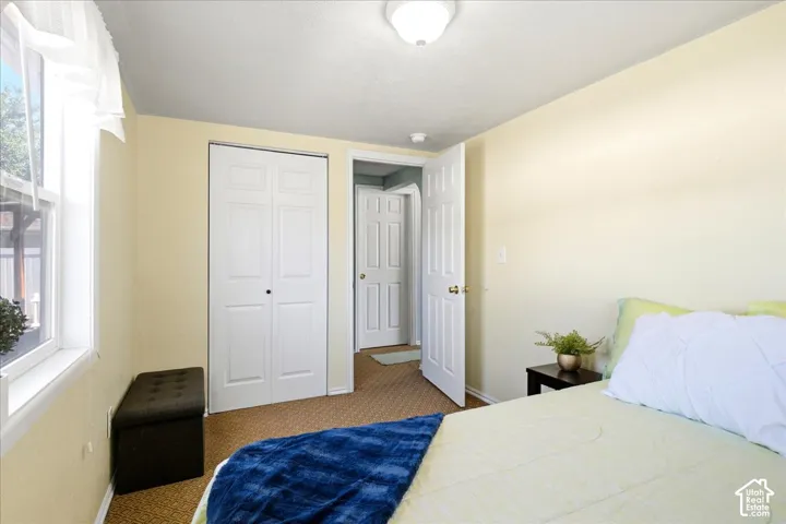 Recessed lighting and a multi-pane window illuminate this room