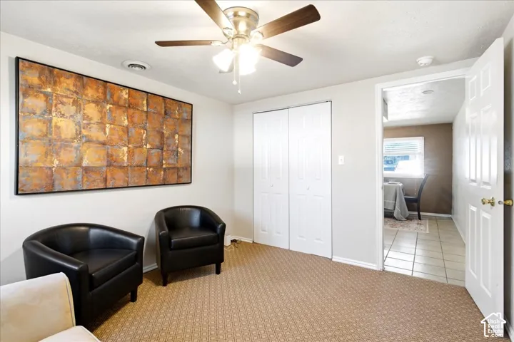 Neutral wall color with patterned carpet flooring