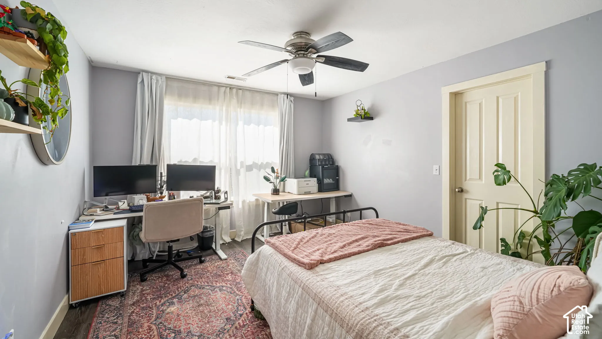 Light-toned walls with dark wood-finish flooring