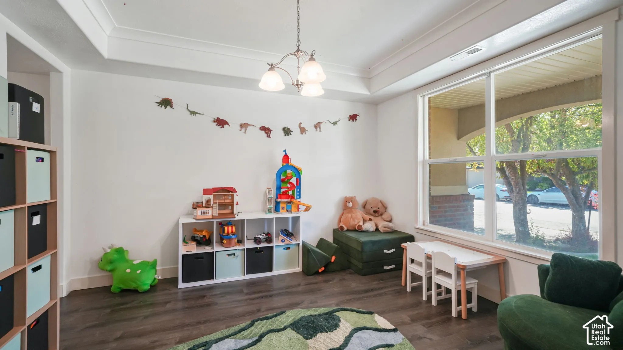 Recessed lighting, crown molding, wood-finish flooring, and large windows
