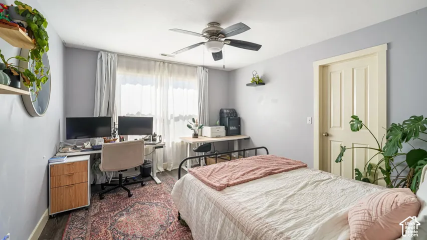 Light-toned walls with dark wood-finish flooring