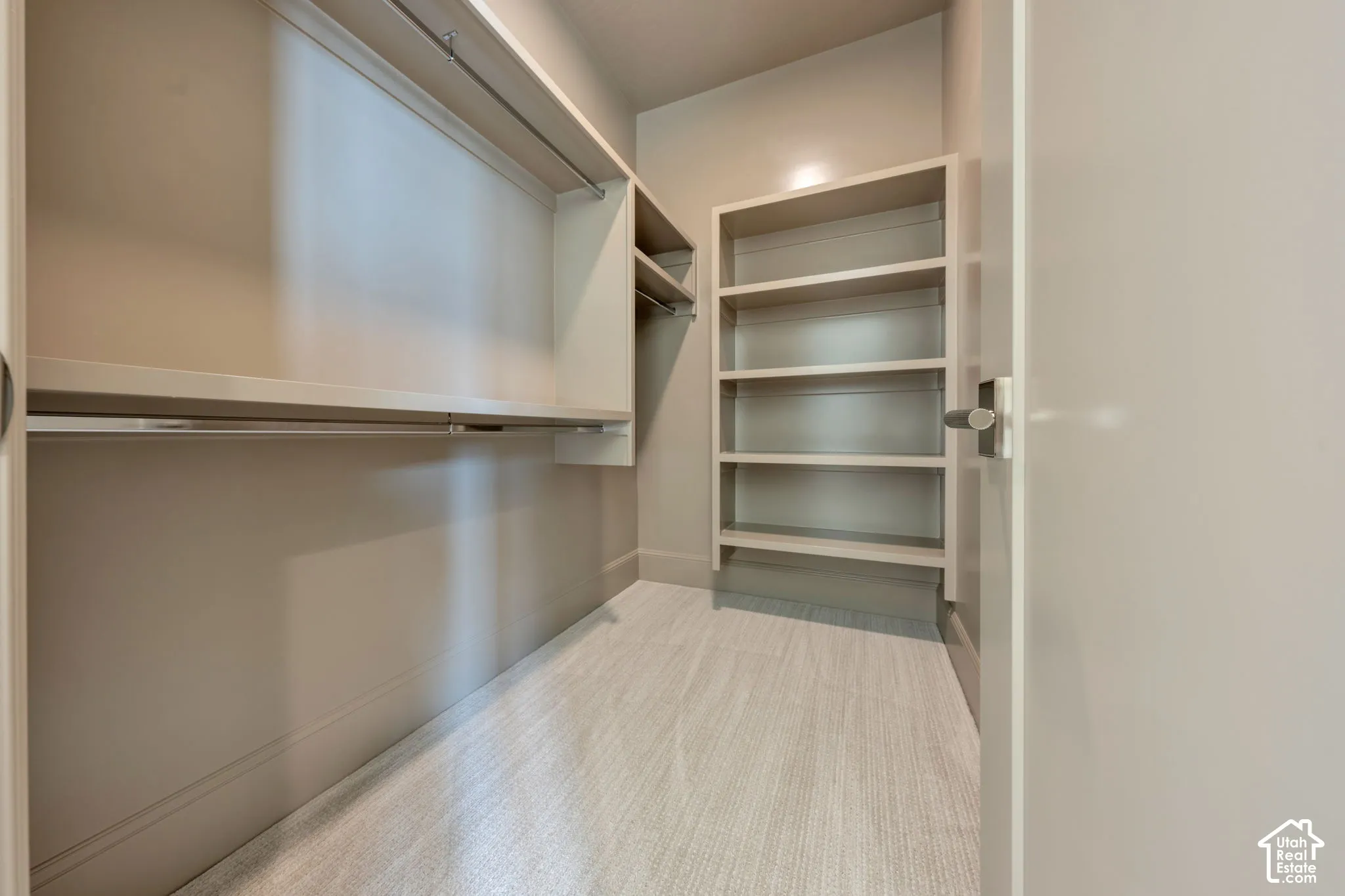 Walk-in closet with integrated shelving units