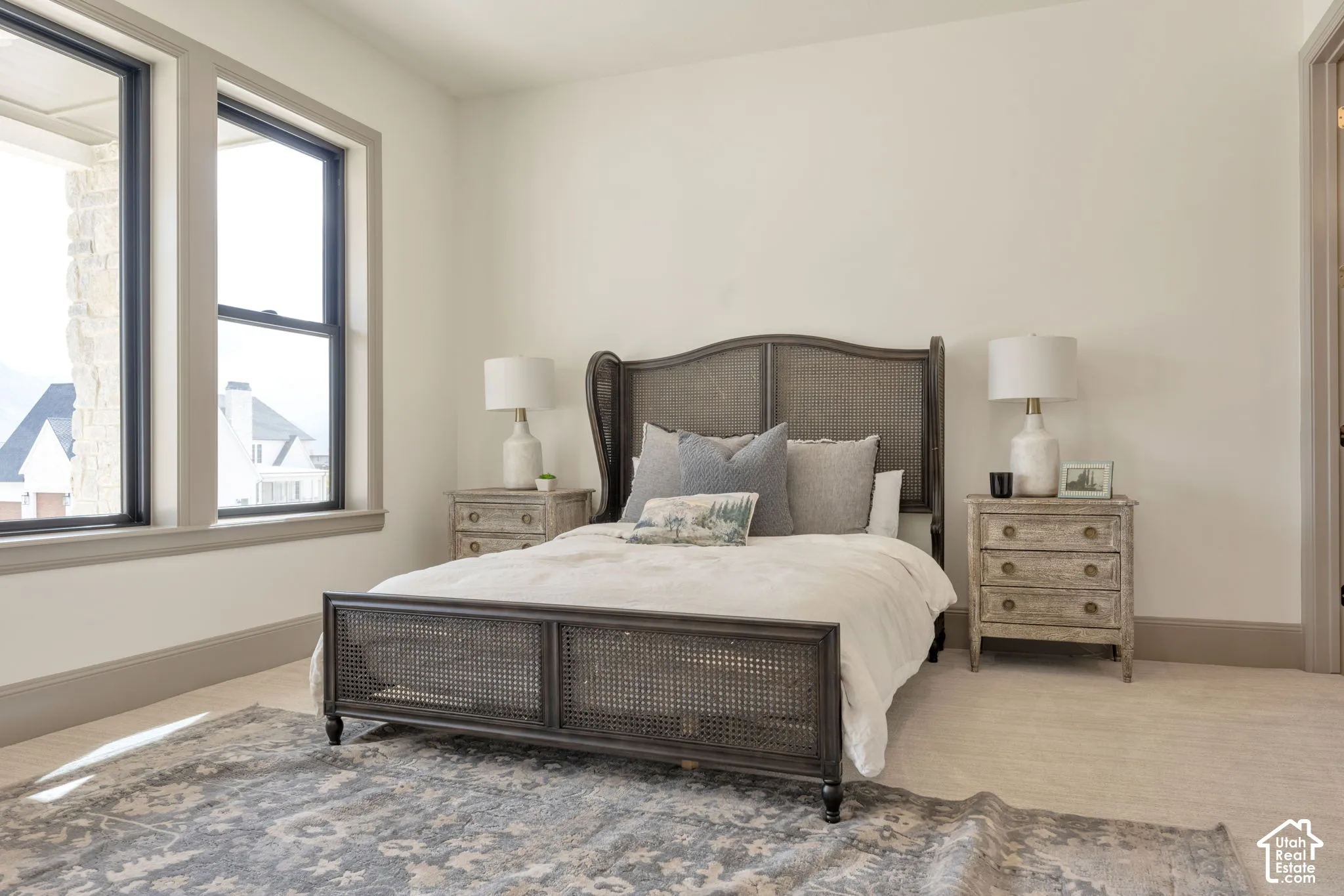 Light-toned walls complement the neutral-toned baseboards and window trim