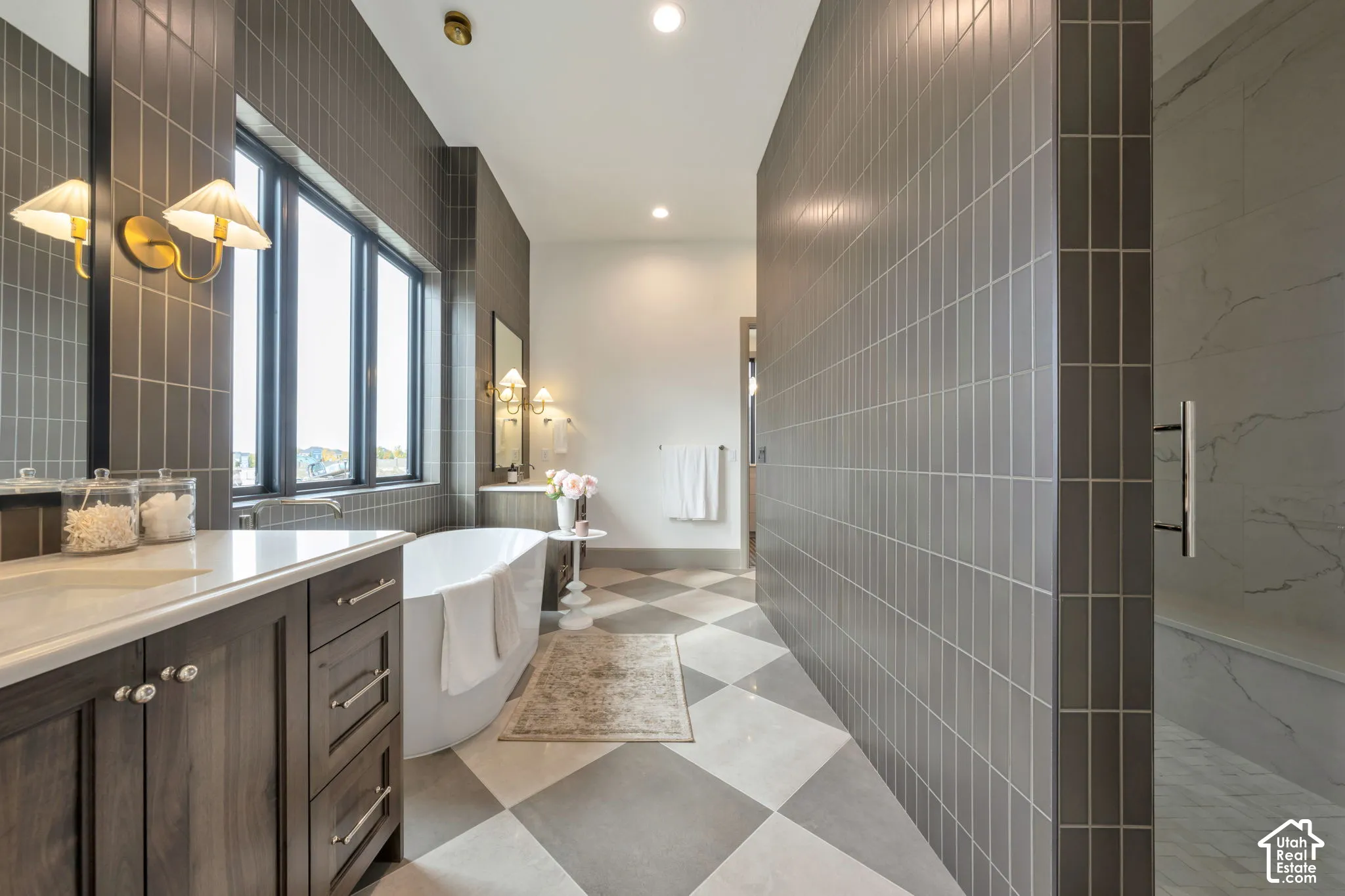 Freestanding soaking tub with checkerboard floor tiling