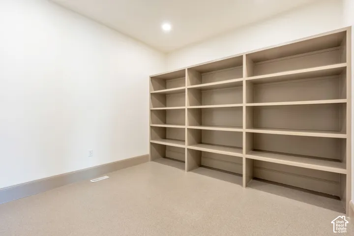 Full-height built-in shelving with multiple storage compartments