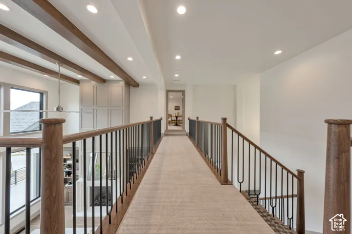 Wood-finish railing with black metal spindles
