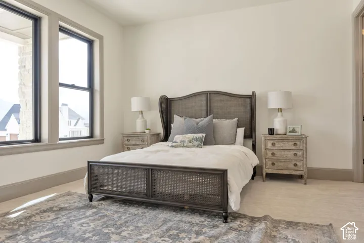 Light-toned walls complement the neutral-toned baseboards and window trim