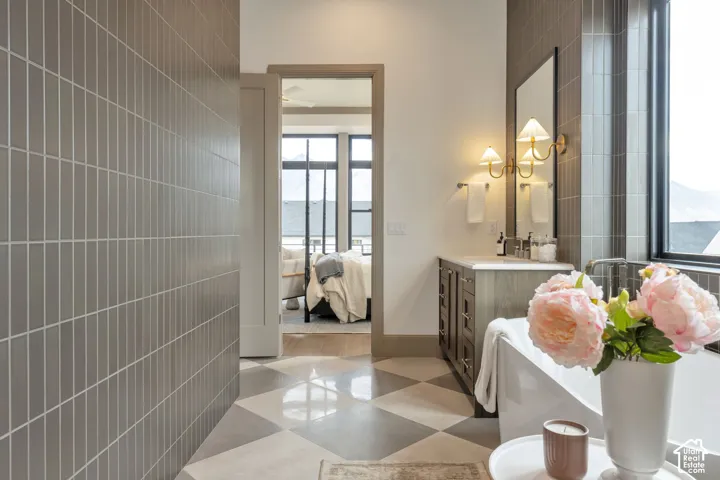 Freestanding soaking tub with a full-height window