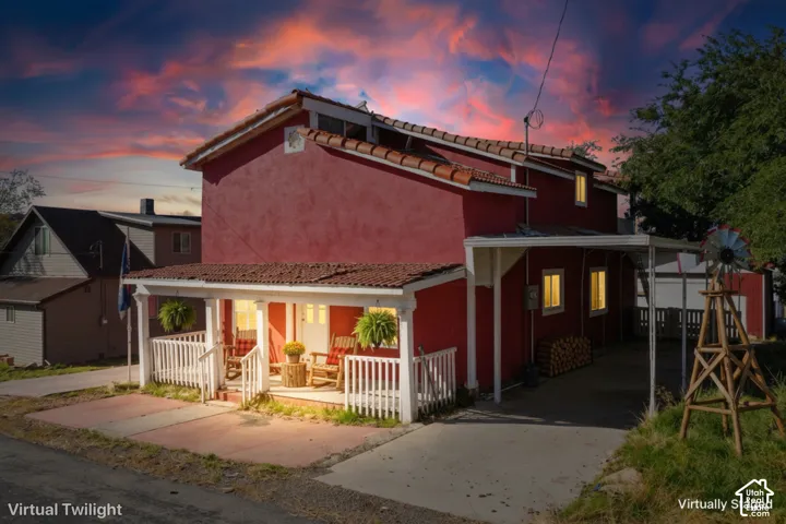 Red stucco exterior with a tiled roof