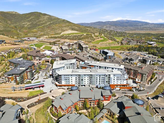 Expansive mountain setting with a variety of architectural styles, including modern and traditional designs