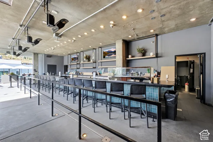 Concrete flooring and ceiling with recessed lighting