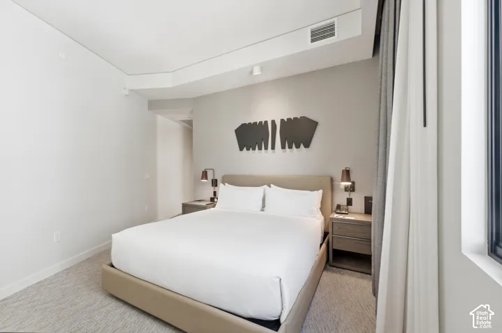 Recessed lighting and ceiling-mounted track lights illuminate the space