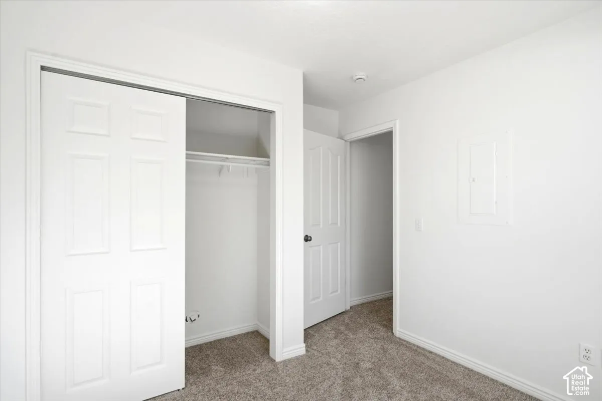 Bedroom #4 - Wall-to-wall carpeting, bi-fold closet doors, and white paneled doors