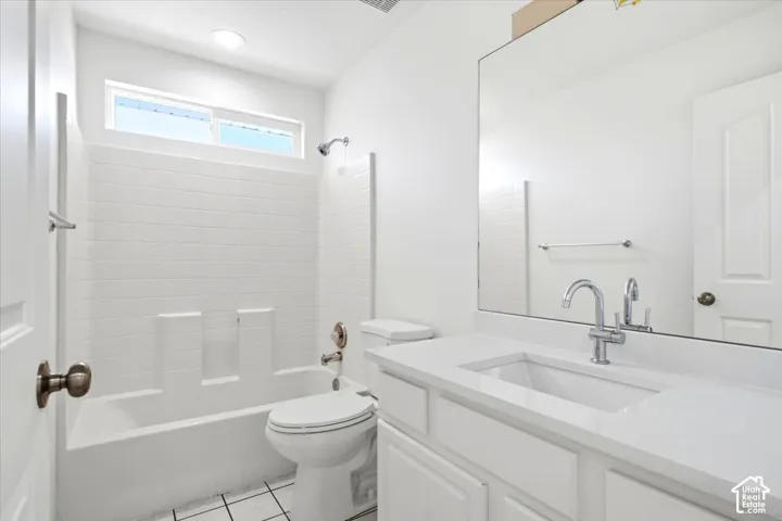 Bathroom #2  - Main bathroom with integrated vanity, a single basin sink and chrome faucet.