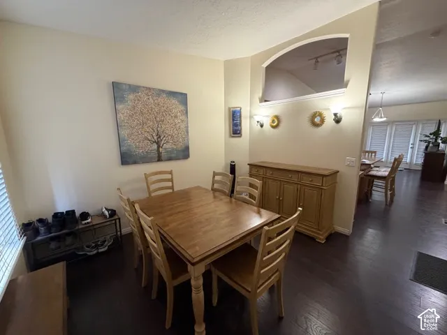 Dark wood-finish flooring with light-toned walls