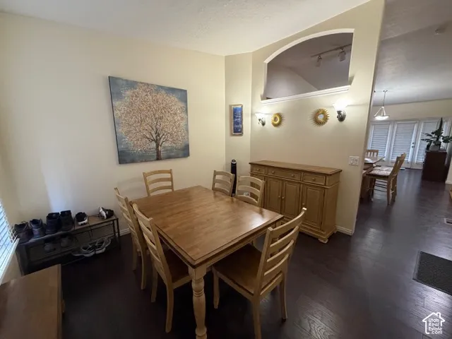 Dark wood-finish flooring with light-toned walls