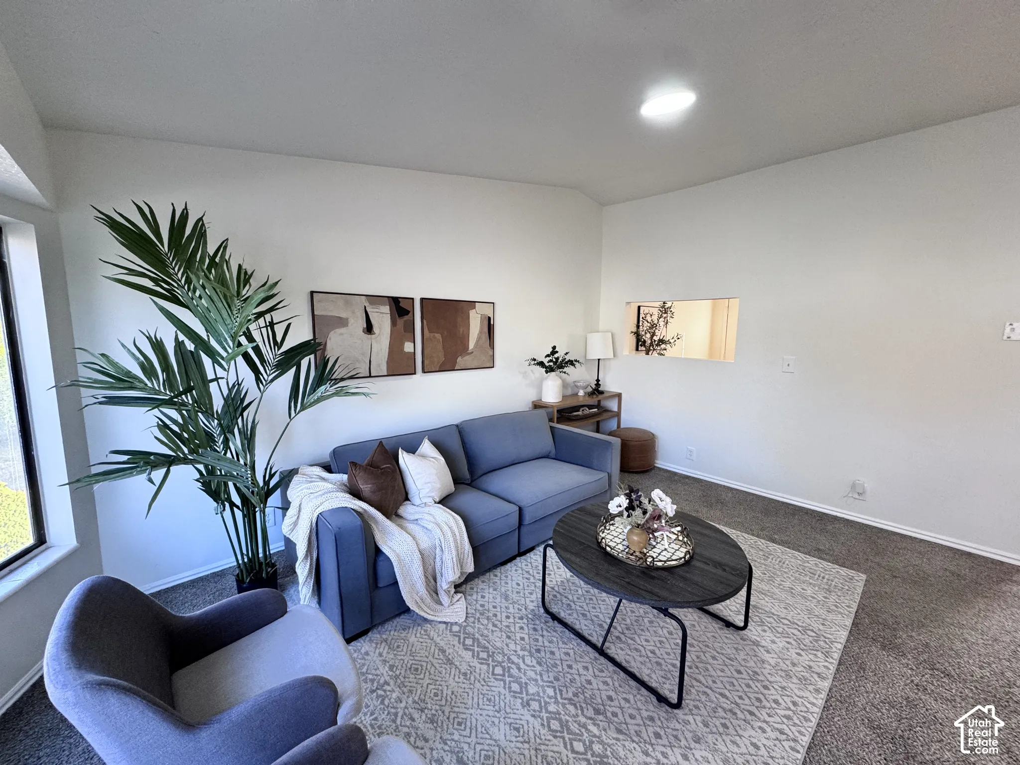 Recessed lighting, large window, and wall-to-wall carpeting