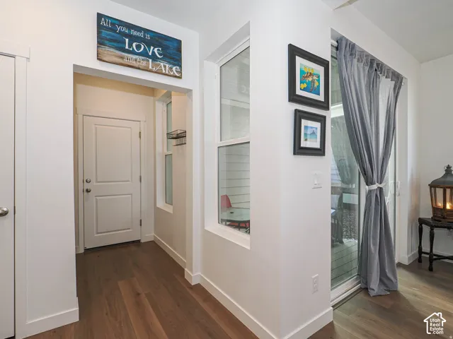 Wood-finish flooring throughout, white interior doors, and modern trim