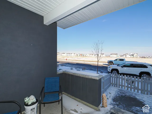 Covered entryway with textured exterior siding