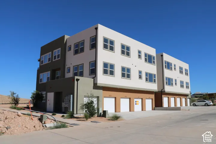 Contemporary exterior with multi-level design, multiple windows, and ground-level garage access