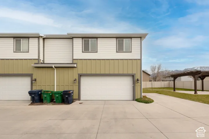 Two-story exterior with horizontal siding and vertical paneling