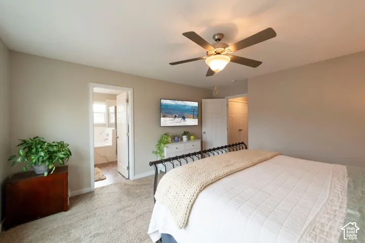Recessed lighting, ceiling fan with integrated light fixture, light-colored carpeting, white interior doors, and a bathroom entry with a built-in tub