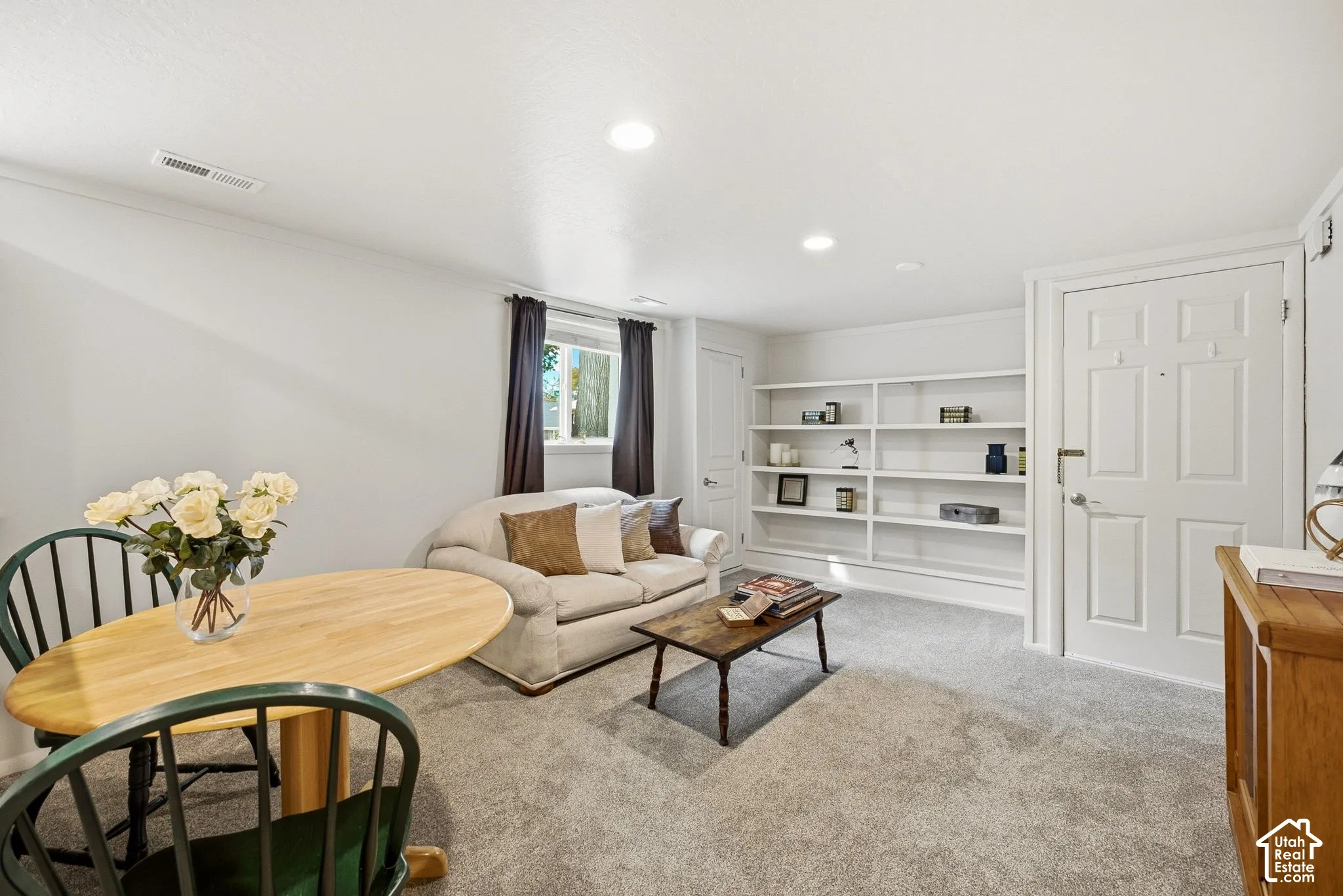 Mother in Law appt with recessed lighting, light gray carpet, egress window, built-in shelving, and separate entrance