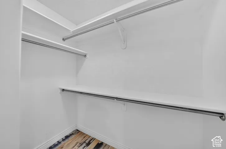 White shelving with integrated hanging rods