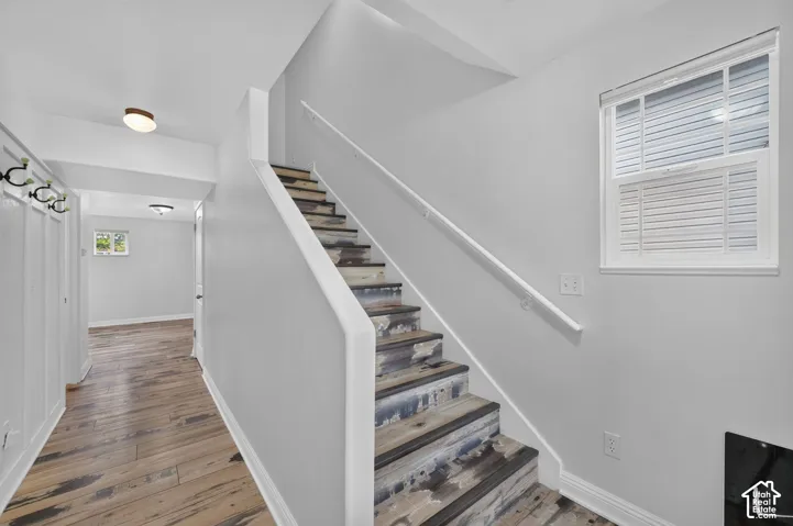 Staircase with unique distressed wood-finish treads and white risers